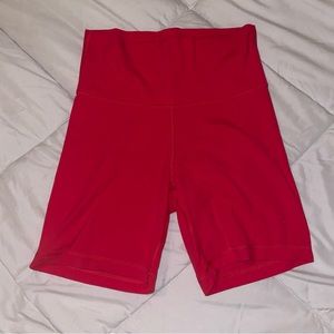 Aritzia TNA Butter 7” Biker Shorts in color Hypno Pink, size Medium